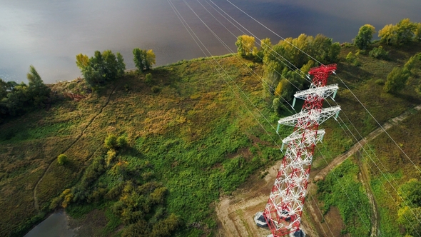 View From Above Structure Supports Overhead Power Line on Lake Bank alt