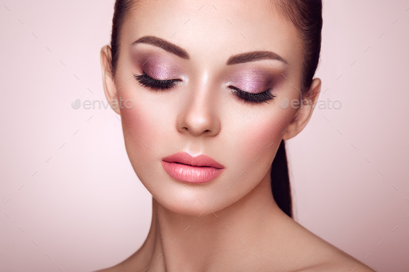 Beautiful woman face with perfect makeup Stock Photo by heckmannoleg