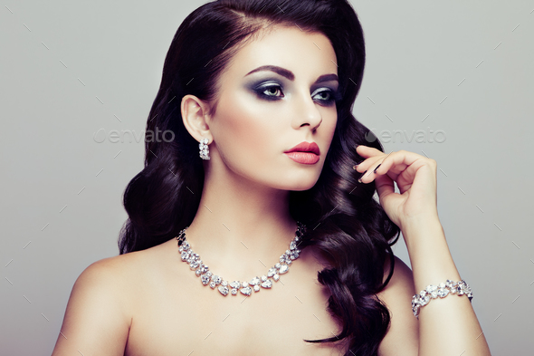 Brunette woman with long shiny wavy hair - Stock Photo - Images