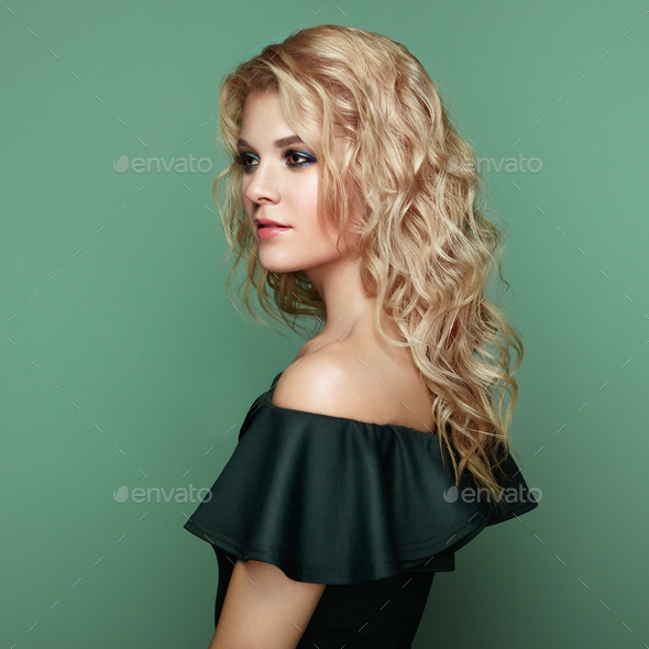 Blonde girl with long and shiny curly hair - Stock Photo - Images
