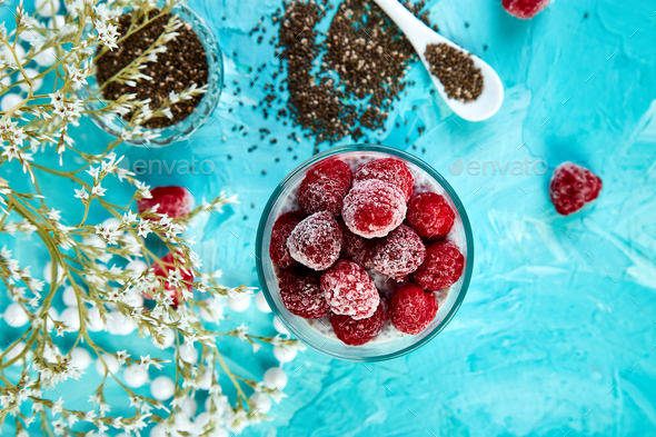 Healthy chia pudding with raspberries in glass - Stock Photo - Images