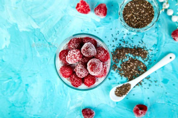 Healthy chia pudding with raspberries in glass - Stock Photo - Images
