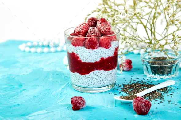 Healthy chia pudding with raspberries in glass - Stock Photo - Images
