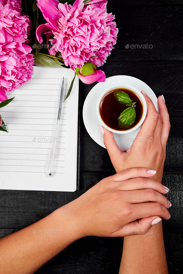 Woman hand writing diary with coffee - Stock Photo - Images