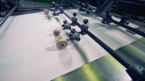 Paper Production Machine. Processing of Secondary Resources. Machine Rollers Move Paper on a alt