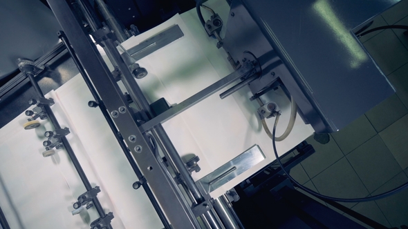 Factory Machine Moves Paper on a Conveyor, Top View. Paper Production Machine alt