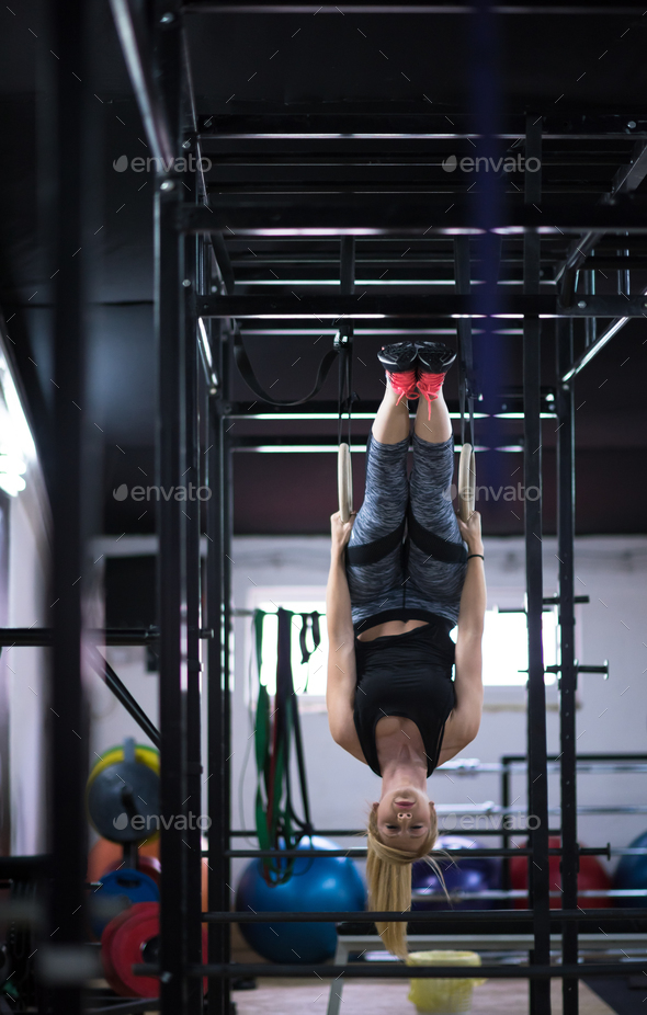 woman working out on gymnastic rings Stock Photo by dotshock | PhotoDune