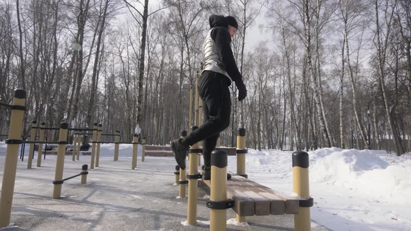 Fitness Man Jumping on Bench During Workout Training on Sport Ground alt
