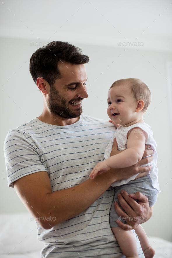 Father holding his baby girl Stock Photo by Wavebreakmedia | PhotoDune