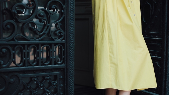 Portrait of an Attractive Young Woman Standing on the Street of a European City