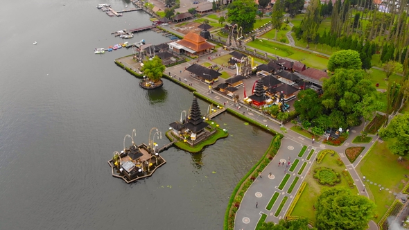 Aerial View on the Pura Ulun Danu Temple on the Lake Bratan in Bali, Indonesia. Drone Rotates Around alt