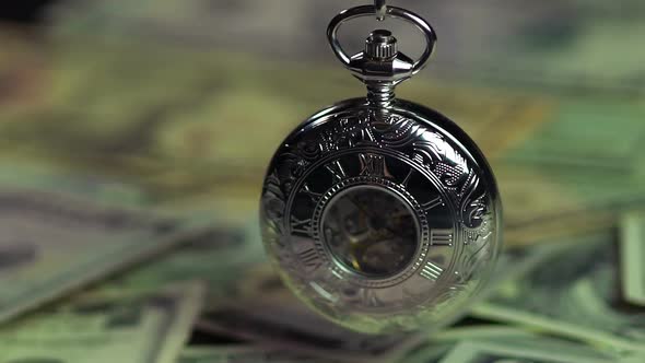 Silver Pocket Watch and Dollars, Time Is Running Out Like Money. Time Management alt