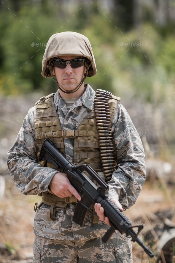 Confident military soldier standing with rifle Stock Photo by ...