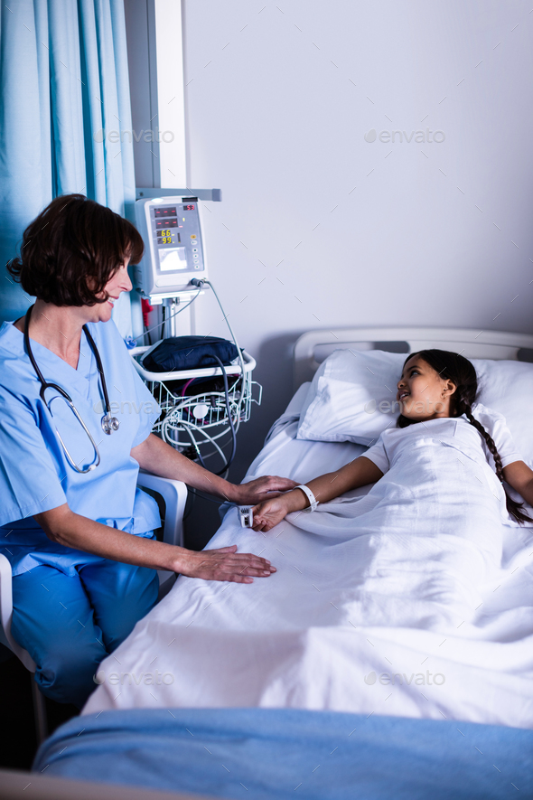 Doctor interacting with patient Stock Photo by Wavebreakmedia | PhotoDune