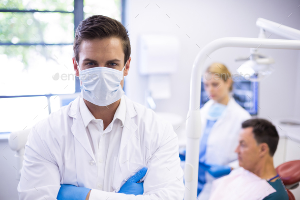 Portrait of dentist wearing surgical mask - Stock Photo - Images
