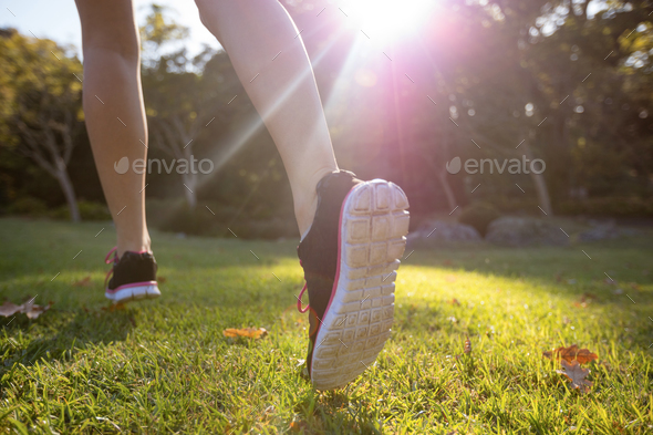 Feet of jogger jogging in the park Stock Photo by Wavebreakmedia | PhotoDune
