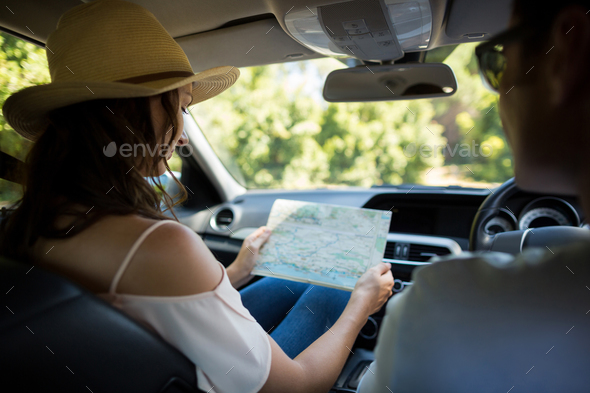 Young woman reading map in car Stock Photo by Wavebreakmedia | PhotoDune