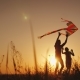 Happy Family Playing with a Kite at Sunset. Mom, Dad and Daughter Are Happy Together - VideoHive Item for Sale