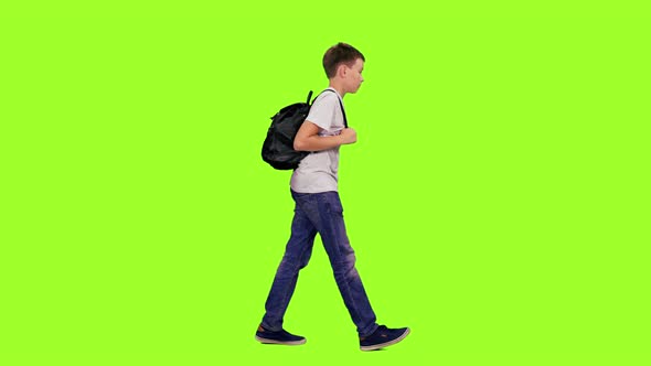 Teenage Boy Walking with Backpack