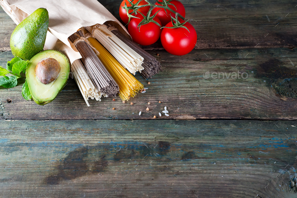 bunch of Italian spaghetti, noodles soba and sommel, avocado with tomato - Stock Photo - Images