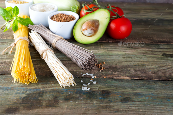 bunch of Italian spaghetti, noodles soba and sommel, avocado, zucchini with tomato - Stock Photo - Images