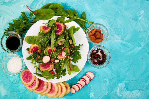 Salad in white plate around Ingredient - Stock Photo - Images