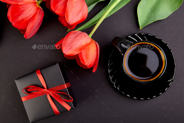 Bouquet red tulips and cup of coffee - Stock Photo - Images