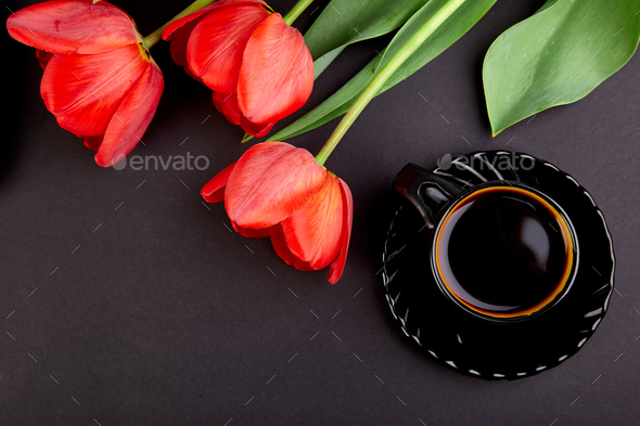 Bouquet red tulips and cup of coffee - Stock Photo - Images