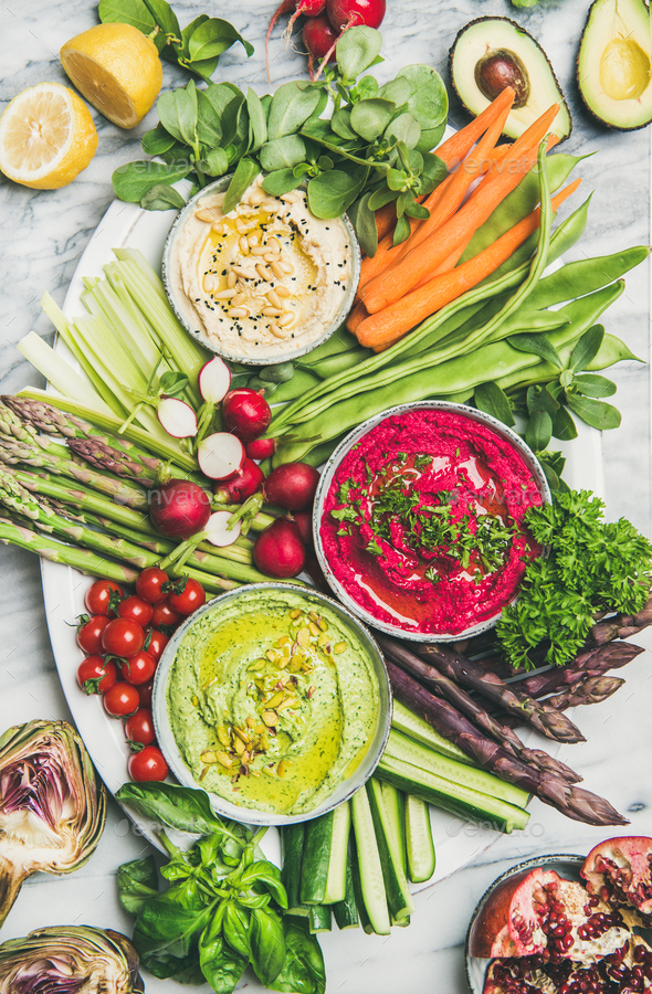 Healthy summer vegan snack plate over marble background - Stock Photo - Images