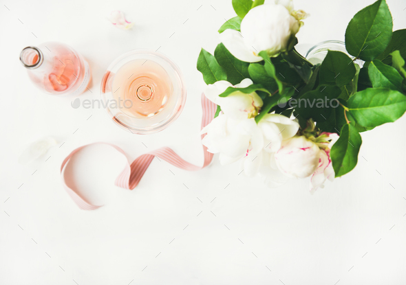 Rose wine and bouquet of peony flowers - Stock Photo - Images