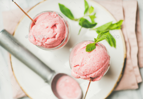 Homemade strawberry yogurt ice cream with mint on plate - Stock Photo - Images