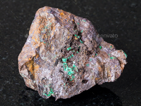 Cuprite and Malachite in Limonite stone on dark - Stock Photo - Images