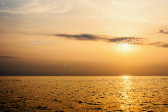 Warm orange light of the sun at sunset - Stock Photo - Images
