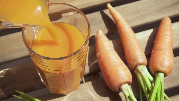 a Glass of Juice on a Wooden Table Top View