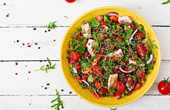Salad bowl lunch with grilled chicken and quinoa, tomato, sweet peppers - Stock Photo - Images