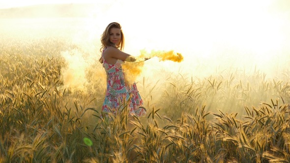 Woman with Colored Yellow Smoke