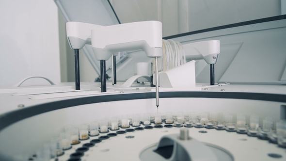 Modern Laboratory Machine Automatically Checks Blood Samples at a Hospital. alt