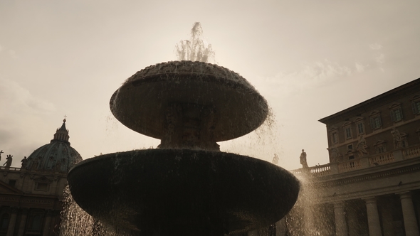 The Famous Fountain of San Pietro Italian Square with Saint Peter Church Columns, in Rome, Italy. alt