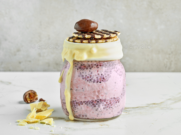 chia pudding with frozen banana and blackberries Stock Photo by magone
