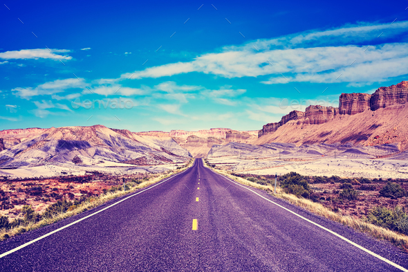 Vintage toned picture of a scenic road. - Stock Photo - Images