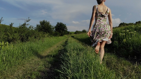 Cheerful Young Girl Walking Barefoot on a Country Road. Taken on Mavik ...