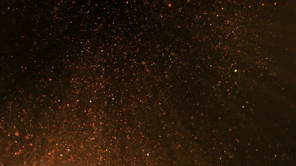 Super Slow Motion Shot of Golden Glittering Atmospheric Particle Background on Black at 1000 Fps alt