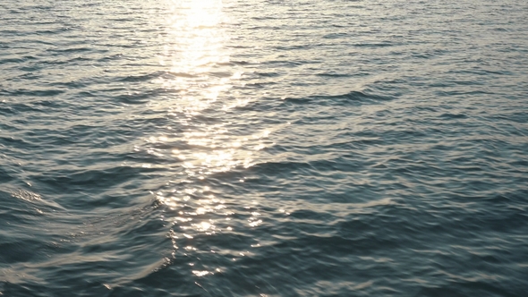 Aerial View on Water Waves at Sunset