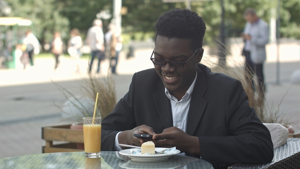 Young Afro American Businessman Using Smart Phone alt