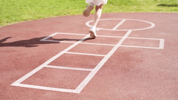 Girl Playing Hopscotch