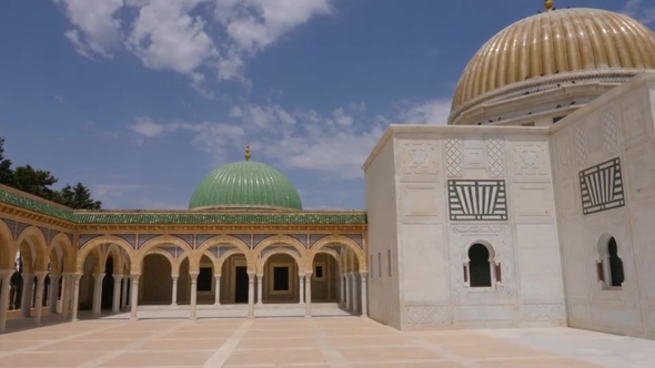 Colonnade with Arches and Entrance To Mausoleum Habib Bourguiba in Monastir City Tunisia. Dolly Shot alt