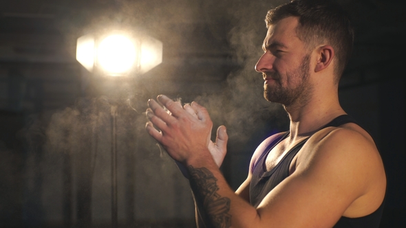 Male Powerlifter Hand in Talc Palm Preparation Before Lifting Weights Hands in Chalk