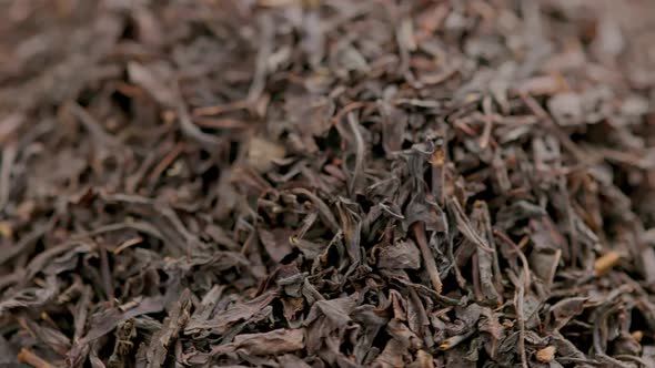 Looped Spinning Dry Black Tea Full Frame Closeup Background alt