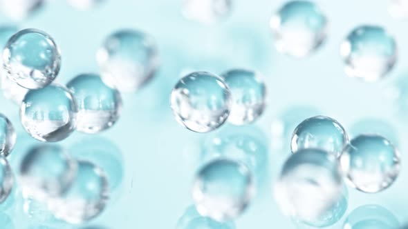 Super Slow Motion Shot of Hydrogel Balls Bouncing on Glass at 1000Fps alt
