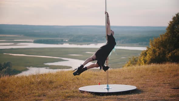 Woman with Blue Braids on High Heels Dancing By the Pole Outdoors on Nature alt